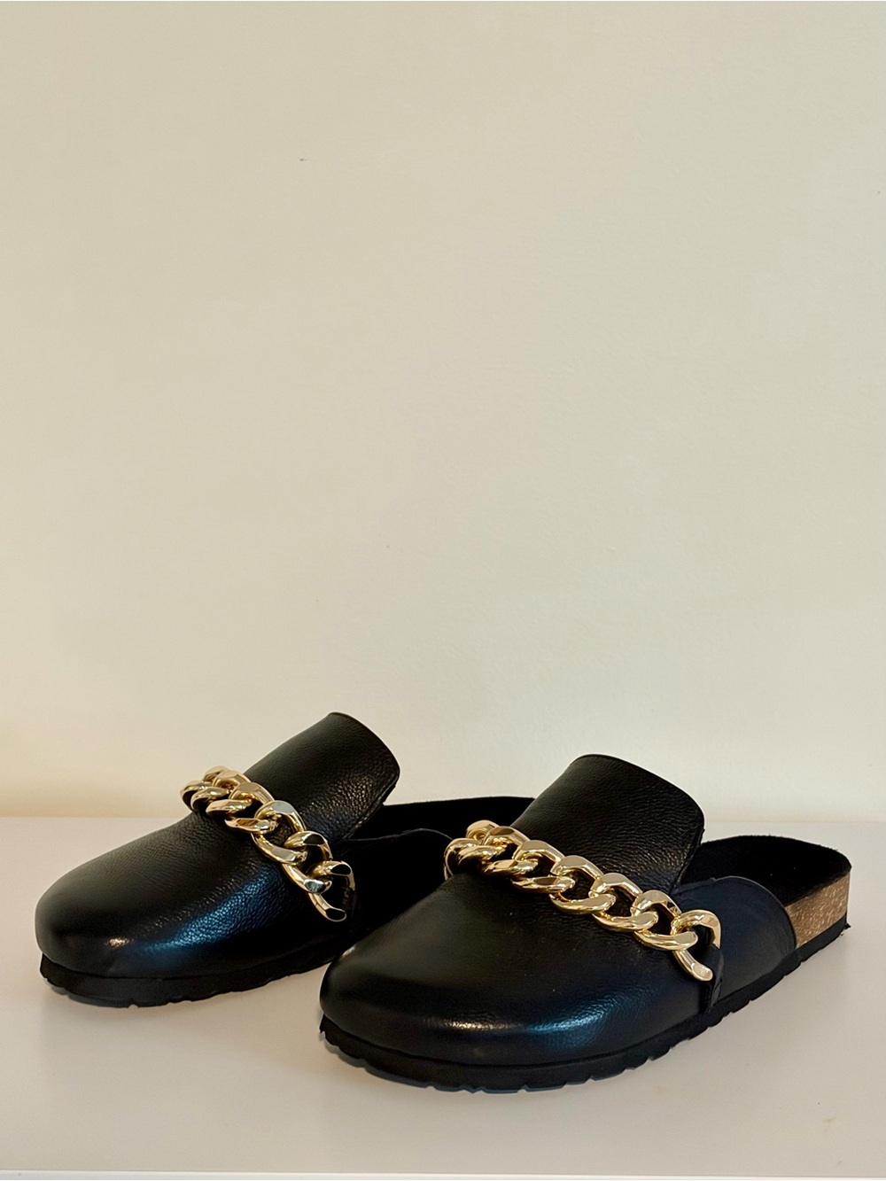 ASOS DESIGN Black mules with a chunky gold chain accent